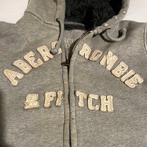 Abercrombie & Fitch faux fur complete lined gray zip up hooded jacket.